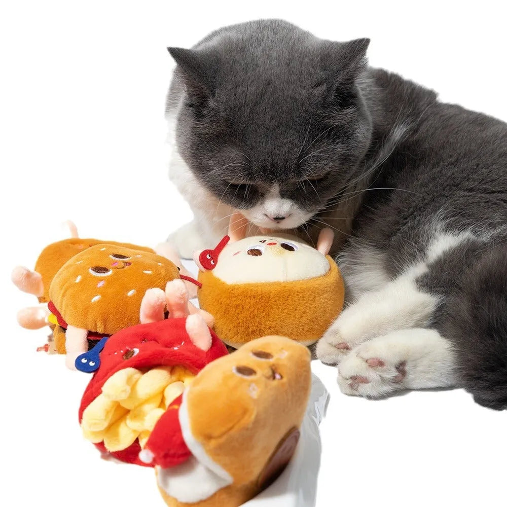 Assorted soft kitten teething toys shaped like a hamburger, chicken leg, fries, bread, and hot dog.