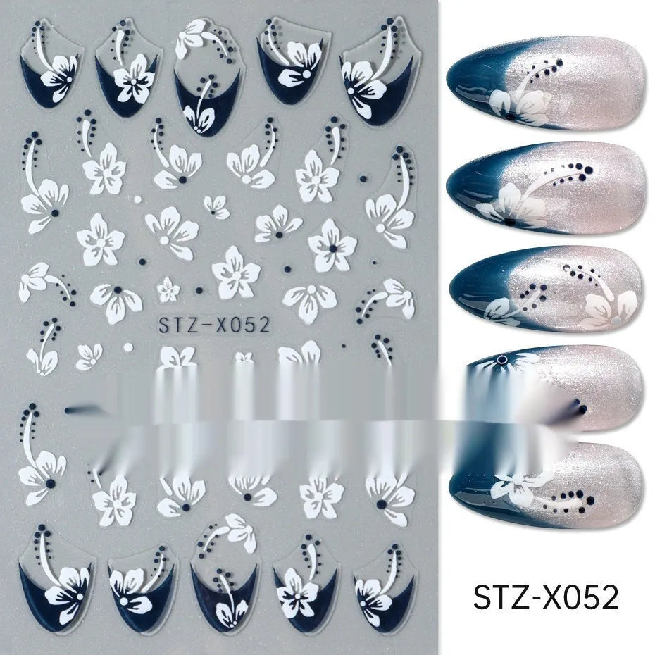 Sheet of black and silver strip nail art stickers with cartoon and love heart designs