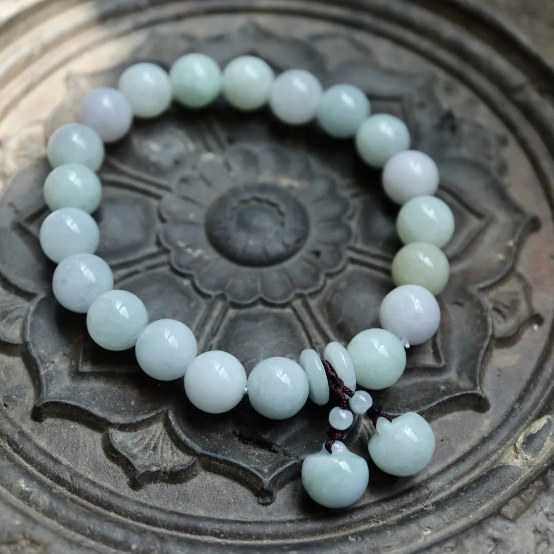 Green jade bracelet with geometric hanging beads and Maitreya Buddha charm