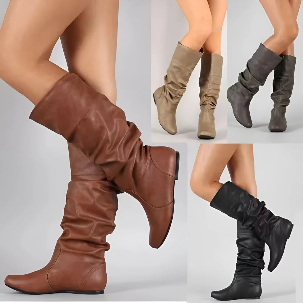 Women's black flat heel long slip-on boots with a round toe and high cylinder length.