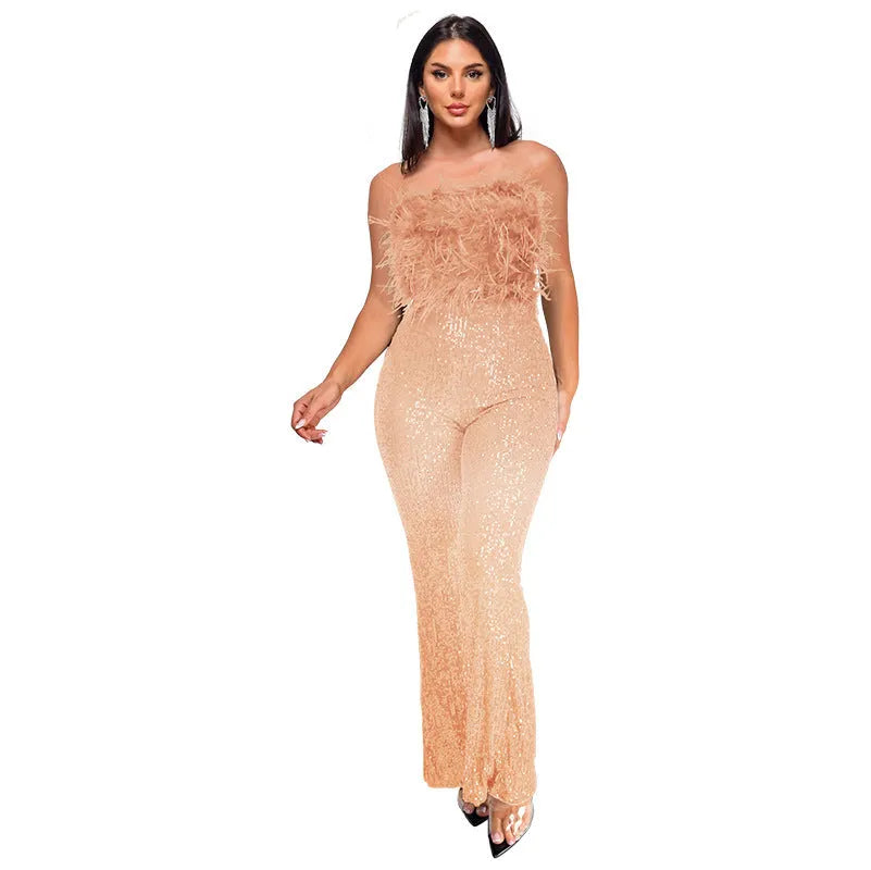 Women's sleeveless backless jumpsuit with flared legs in a champagne colour on a mannequin.