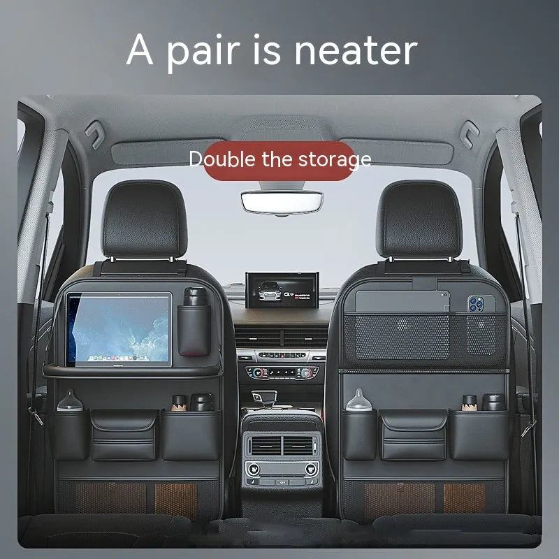 Car seat lazyback storage bag in Obsidian Black with foldable dining table extended, hanging on a car front seat backrest