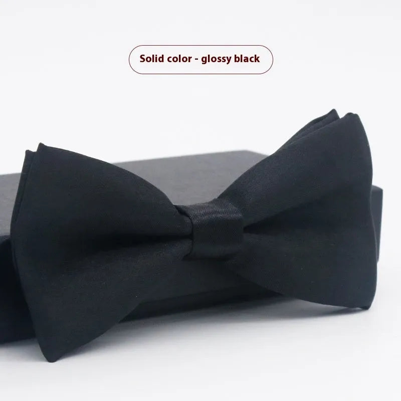 Solid colour polyester bow tie with flat head design measuring 12cm by 6cm