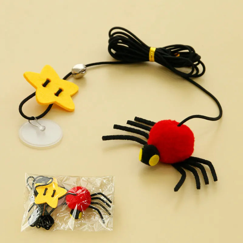 Hanging door cat toy with elastic rope, feather, bell, and spider attachment in red colour