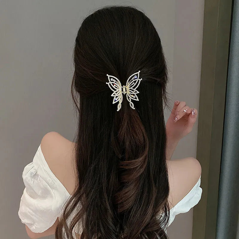 Butterfly-shaped hair clip for women in alloy metal with rhinestone or pearl decorative elements