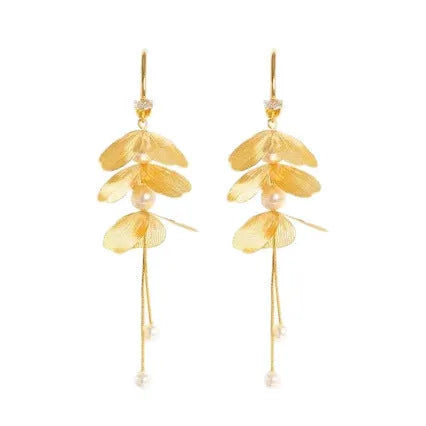 Gold floral petal pearl fringe drop earrings with electroplated alloy finish on neutral background