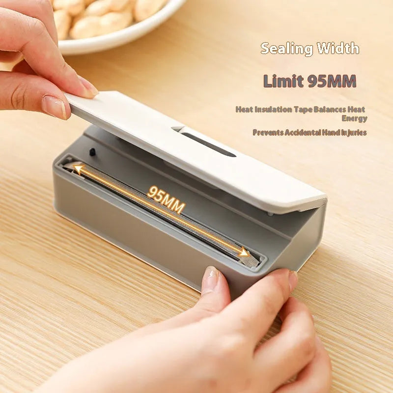 Small white and blue manual heat sealing machine for plastic food bags.