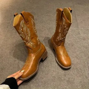 Brown women's mid-calf Martin boots with embroidered detail, round toe, and low square heel.