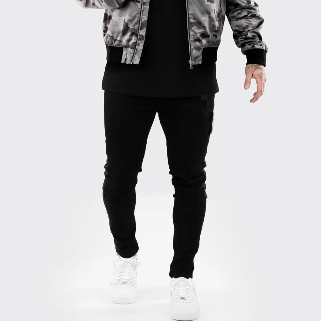 Men's ripped black slim-fit high waist cotton denim trousers with elastic waist
