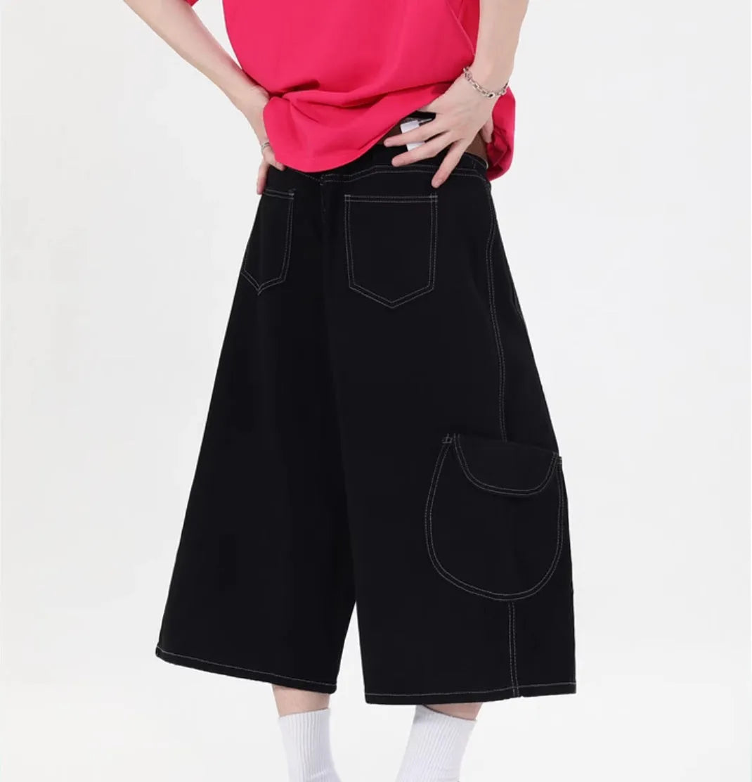 Black and red wide leg denim cropped pants with multiple pockets and mid waist
