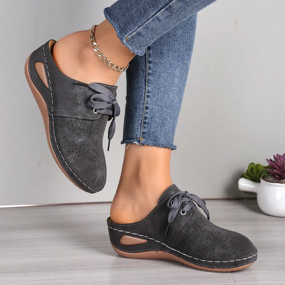 Women's lace-up Baotou slippers with hollow-out wedge design in suede material, available in multiple colours.