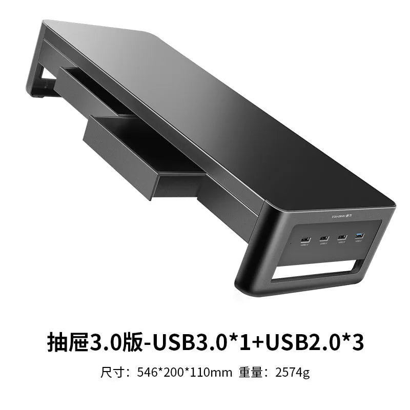 Desktop screen stand with drawer in black, featuring USB and wireless charging ports under monitor