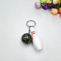 Mini bowling pin keychain pendant in four colour options with key ring attachment