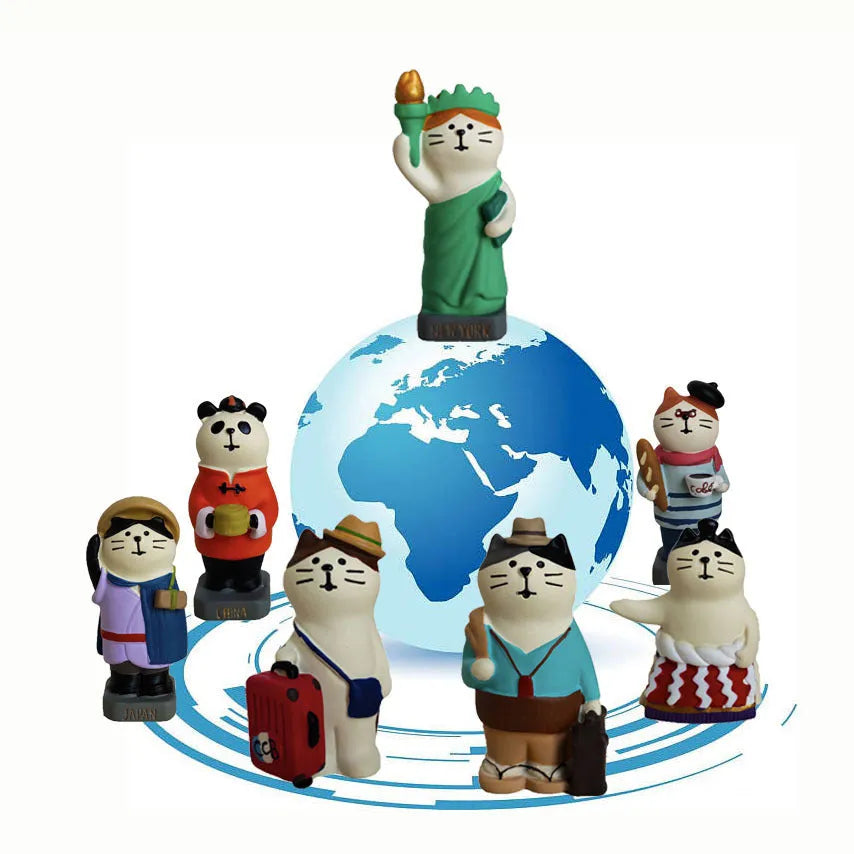 Cartoon resin craft sculpture of a cat dressed as the Statue of Liberty, holding a globe.