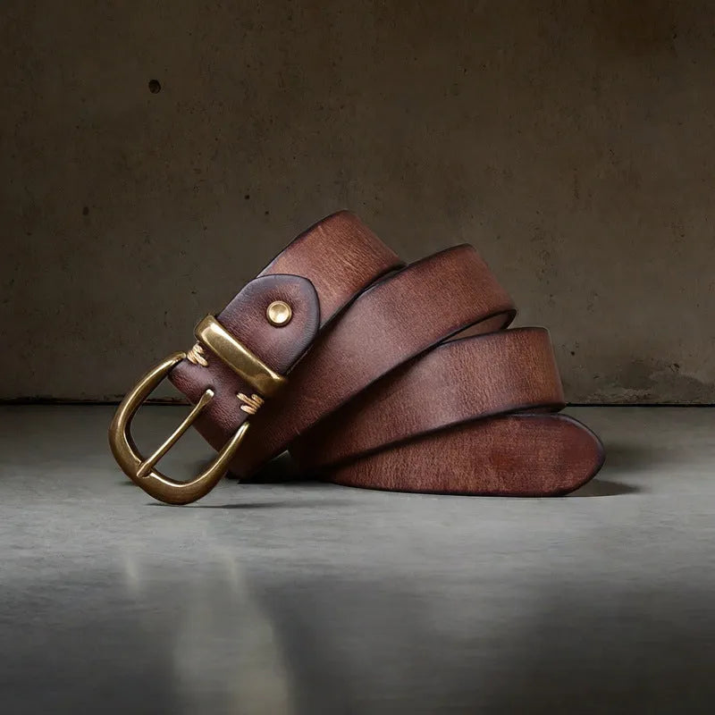 Men's black genuine cowhide casual belt with copper pin buckle on a jeans background