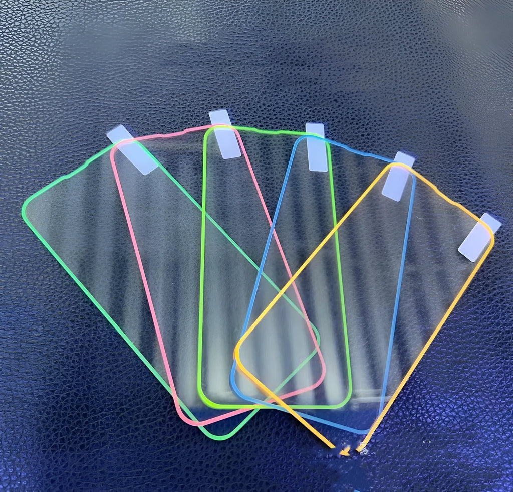 Luminous pink tempered glass screen protector fitted on an iPhone 13 Pro.