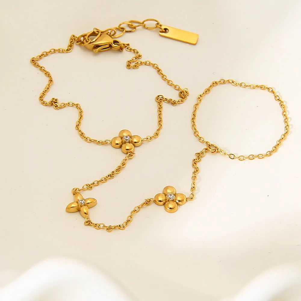 Gold stainless steel women's bracelet with geometric flower and eight-pointed stars design