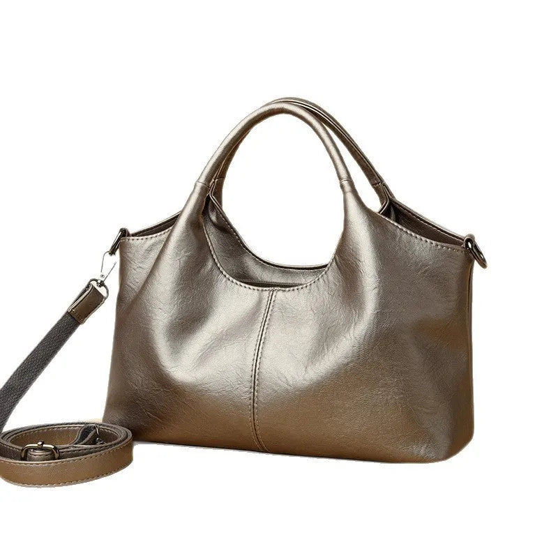 Genuine leather women's cross-body bag in multiple colours showing large capacity design
