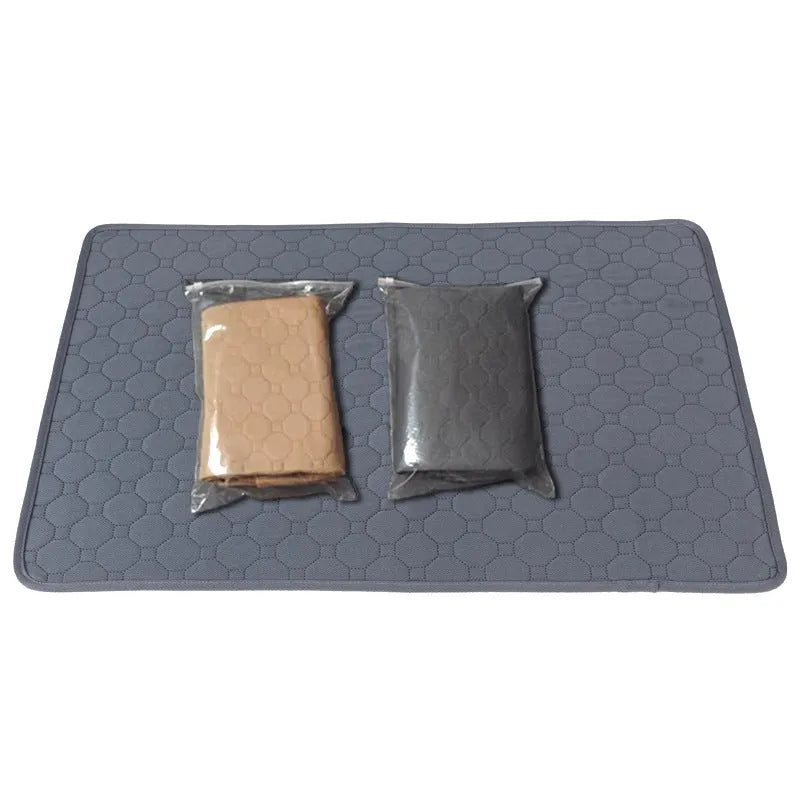Pack of grey and tan washable, reusable dog pee pads in various sizes on a wooden floor.