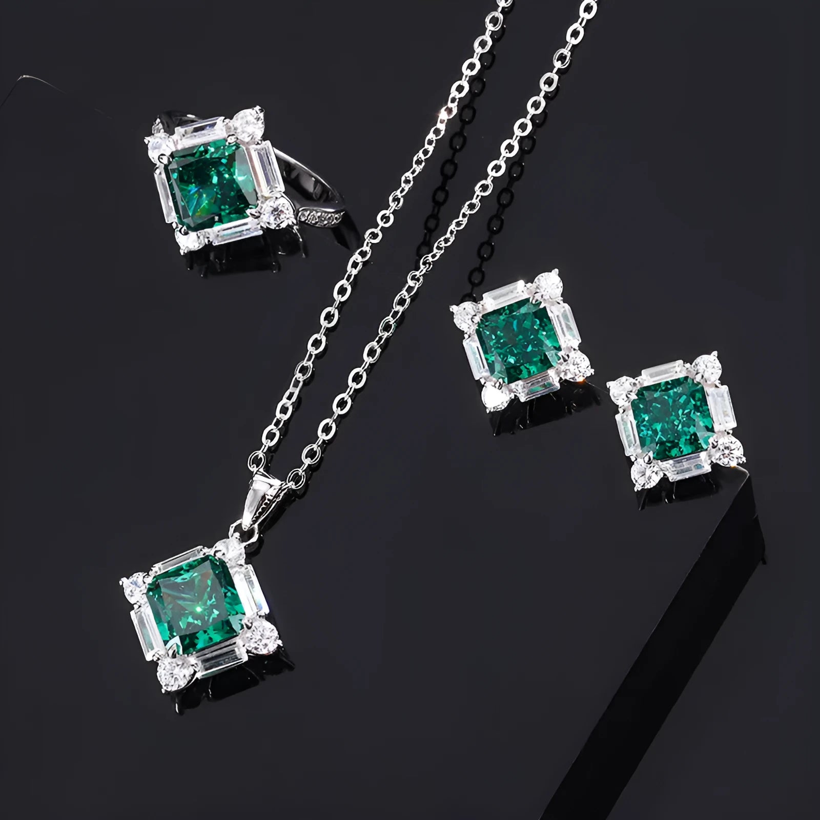 S925 silver emerald diamond jewellery set with necklace earrings and ring on display