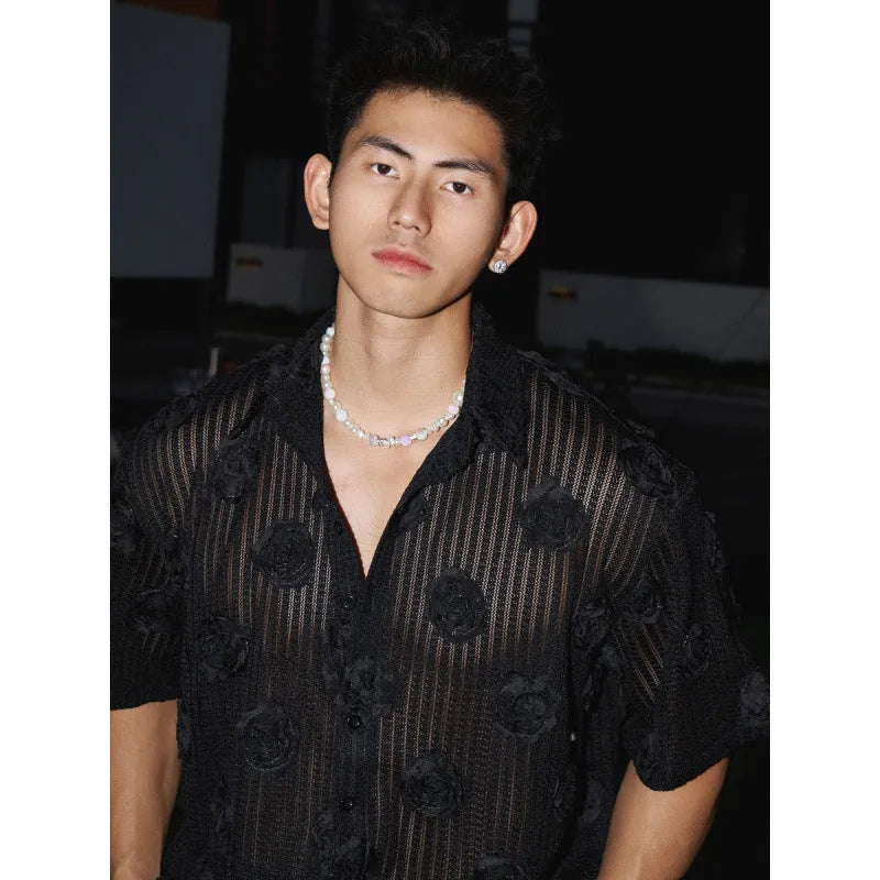 Man's loose fit short sleeve shirt with a heavy industry floral print in black.