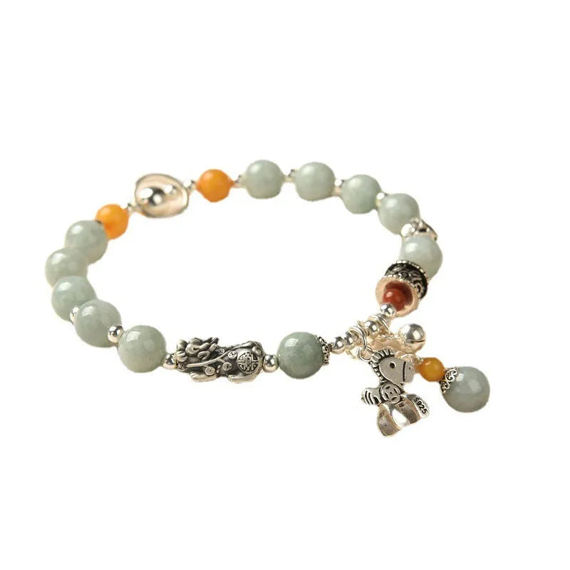 Natural emerald green jade vintage pony style bracelet with an alloy clasp.