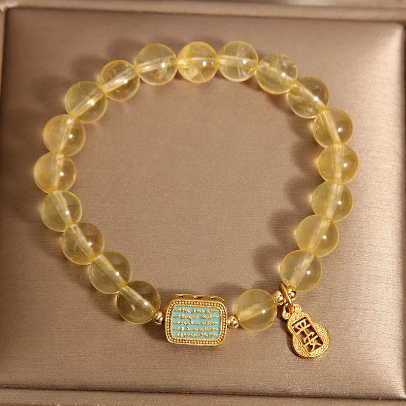 Women's citrine crystal bracelet with rhinestone decorative details showing natural yellow colour