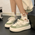 Green women's flat-heel casual shoes with round toe and mesh upper
