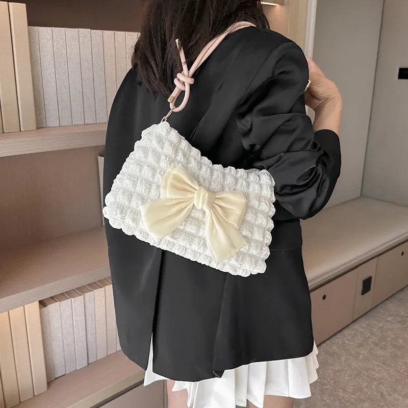Women's canvas shoulder handbag with sandwich pocket design in black colour showing horizontal square shape