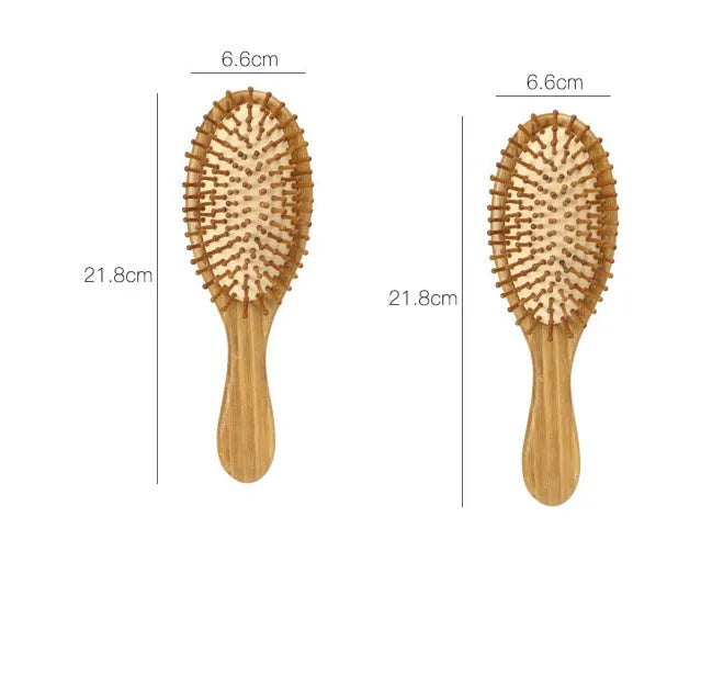 Carbonised bamboo massage comb 66x218mm on neutral background with smooth wooden surface visible