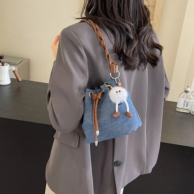 Blue synthetic leather one-shoulder cross-body bucket bag with optional hanging ornaments