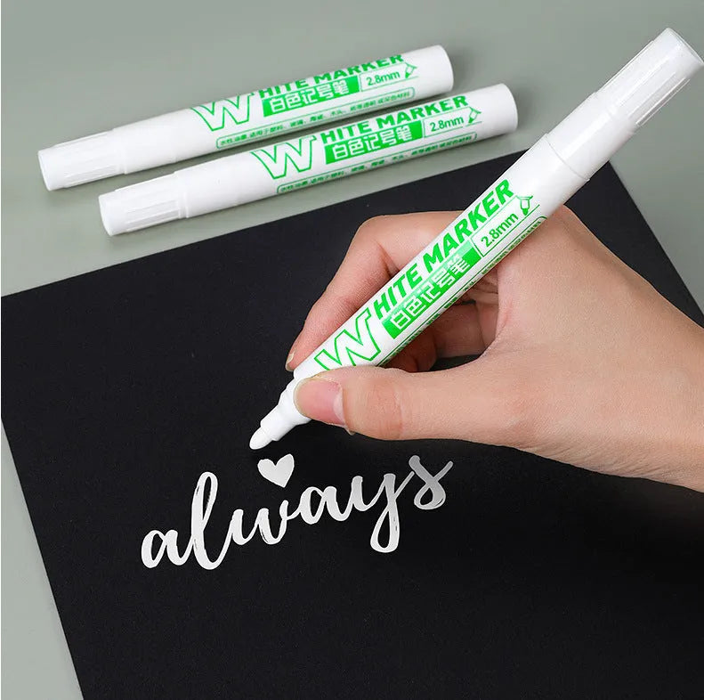 Super White Dazzling fine head painting pen with 2.8mm thick white tip, 14cm length, on dark surface
