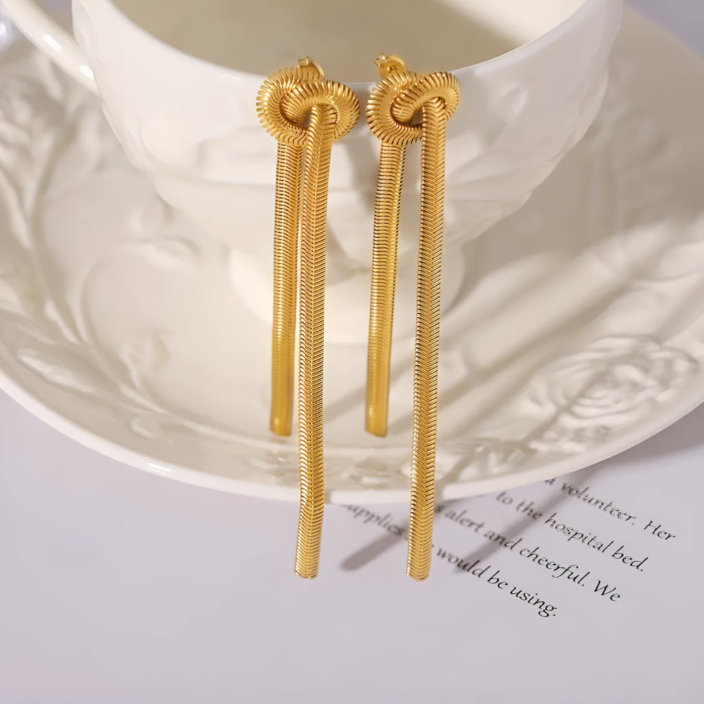Gold knotted tassel pendant on snake chain necklace with matching earrings