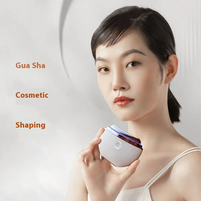 Household electric beauty device with scraping head and display showing colour light therapy functions