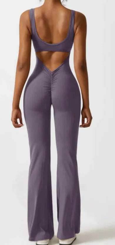 Black women's tight seamless yoga bodysuit with a mid waist and trousers length.