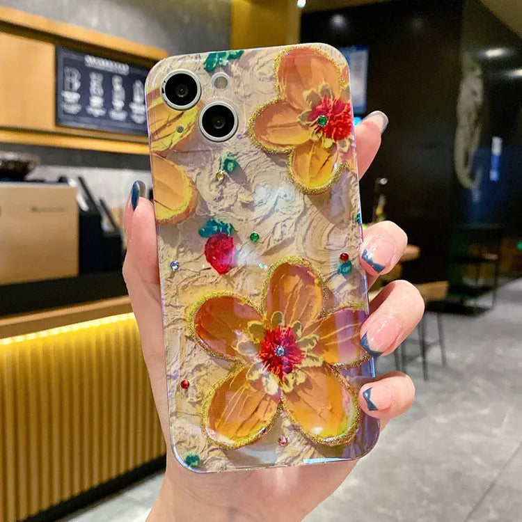 Purple soft rubber phone case with oil painting flower design and inlaid diamond detailing.