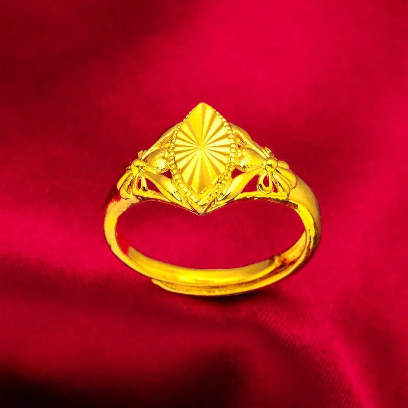 Gold geometric flower ring with open diamond design and textured surface on brass base