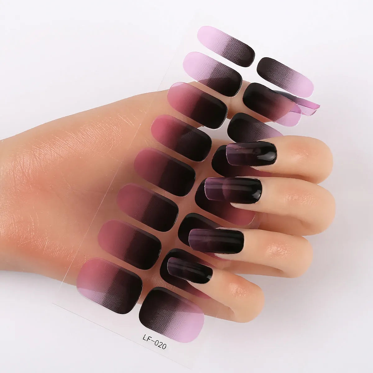 Set of 16 solid colour full nail art stickers showing patterns like cross, rose, tulip, and cartoon designs.
