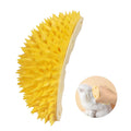 Yellow durian-shaped cat corner scratcher mounted on wall with catnip powder packet