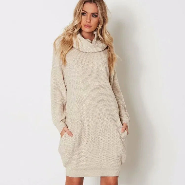 Loose fit mid-length pullover sweater with pockets in imitation cashmere fabric.