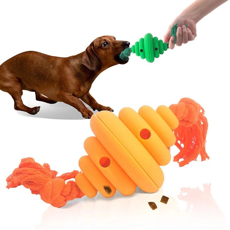 Green and yellow food-dispensing silicone dog ball with an attached rope for tug-of-war.