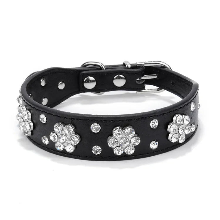 Decorative black PU leather dog collar with studded rhinestone flower pattern and silver metal D-ring.