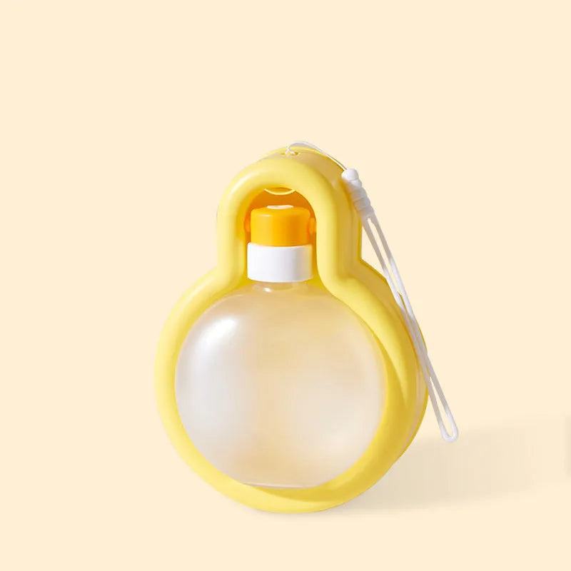 Green portable dog water bottle with pull-out drinking bowl for outdoor travel and camping.