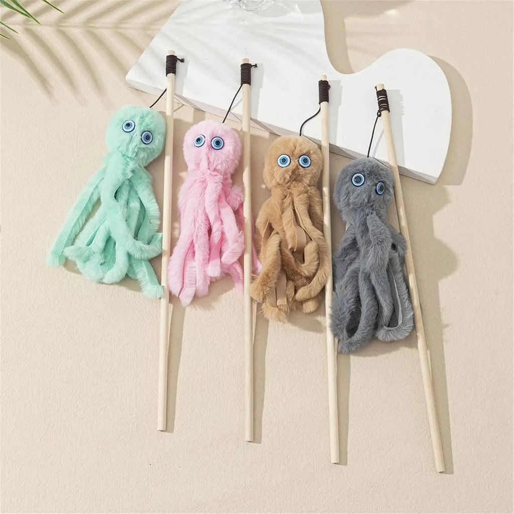 Grey furry octopus cat toy with eyes on a long stick for interactive indoor play with kittens.