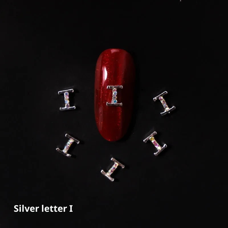 Gold alloy letter A nail ornament charm with crystal detail on a square chain base