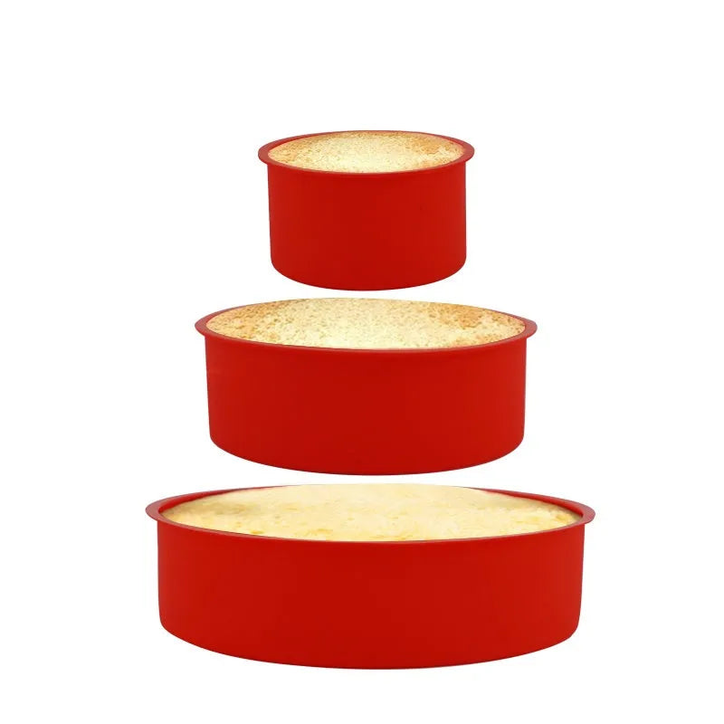 Red round silicone cake mould on a baking tray showing 8 inch size with smooth interior