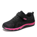 Women's gray purple low-top casual shoes with velcro strap and wedge heel.