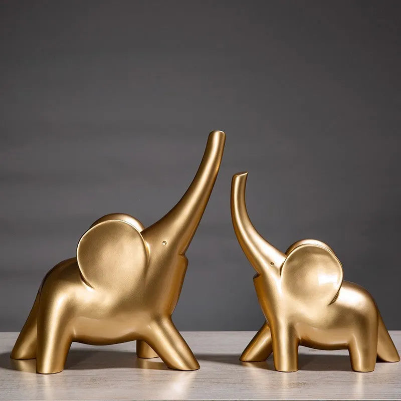 Minimalist solid resin elephant ornament in rose gold on a shelf.