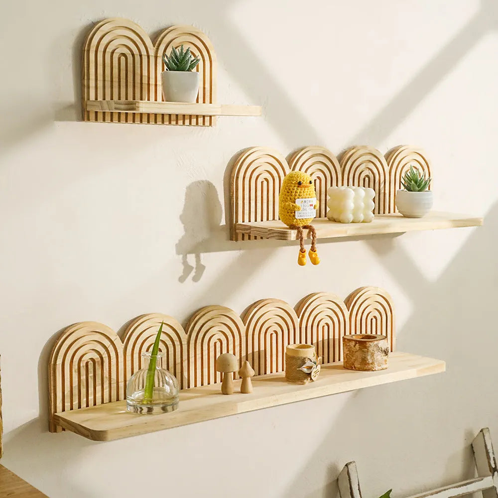 Solid wood multi-tiered wall rack holding several potted plants.