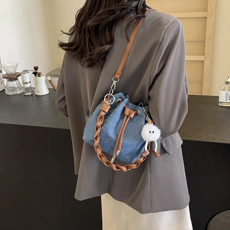 Blue synthetic leather one-shoulder cross-body bucket bag with optional hanging ornaments
